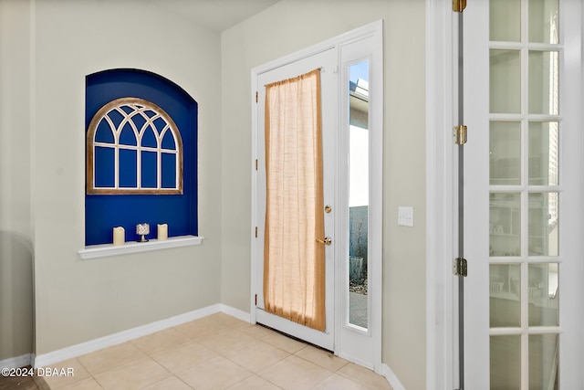 entryway with light tile patterned floors