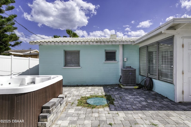 39 Seaview Dr, Ormond Beach, FL 32176 - view of patio with cooling unit, fence, and a hot tub