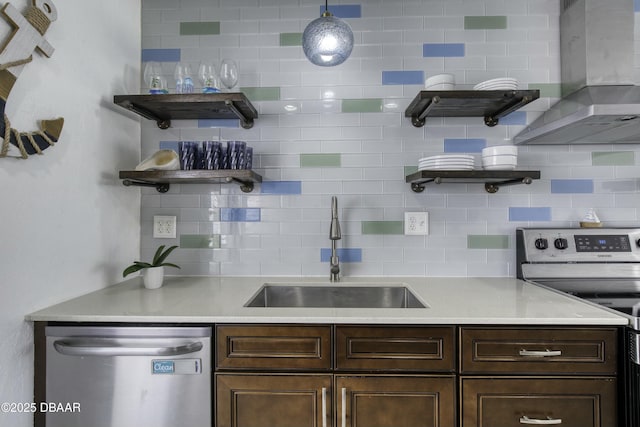 39 Seaview Dr, Ormond Beach, FL 32176 - kitchen featuring a sink, open shelves, appliances with stainless steel finishes, and wall chimney range hood