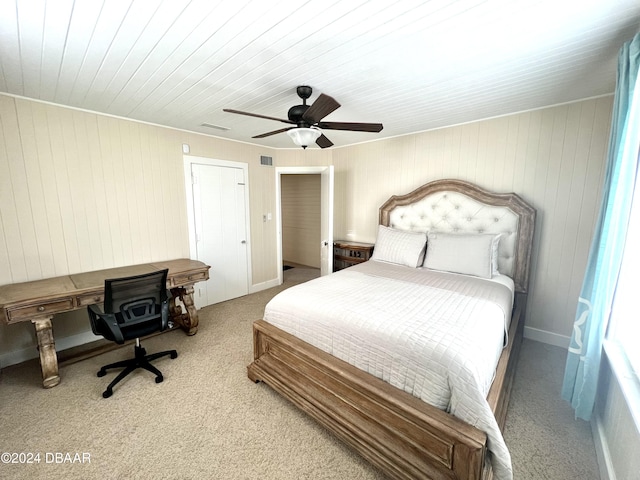 bedroom featuring light carpet and ceiling fan