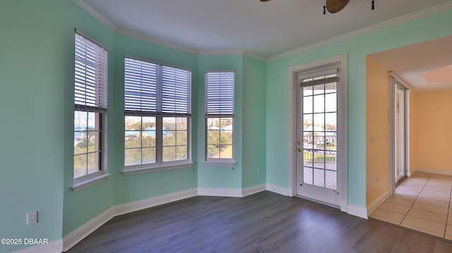 interior space with dark hardwood / wood-style flooring, ornamental molding, and ceiling fan