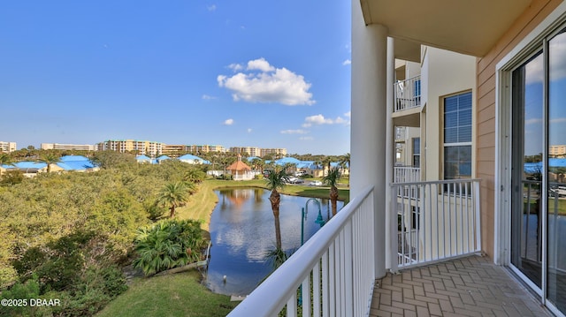 balcony featuring a water view