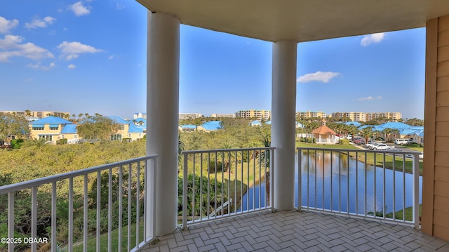 balcony featuring a water view