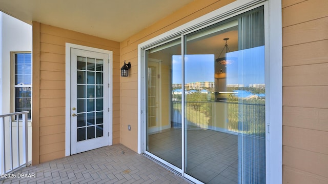 doorway to property featuring a balcony