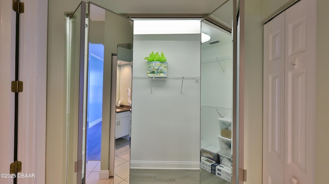 bathroom with vanity and wood-type flooring