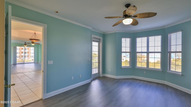 spare room featuring crown molding, ceiling fan, and hardwood / wood-style flooring