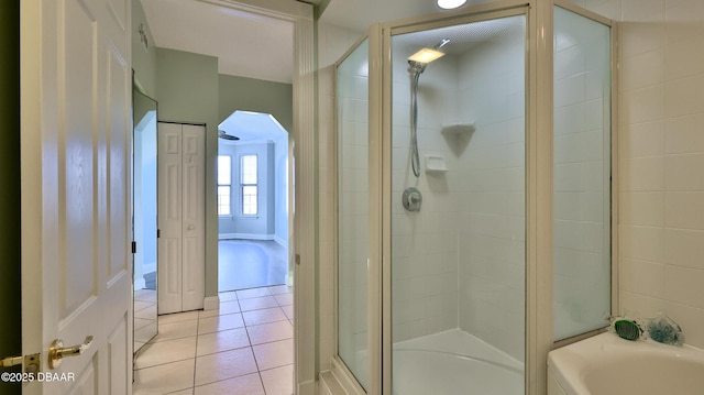 bathroom featuring tile patterned flooring and plus walk in shower