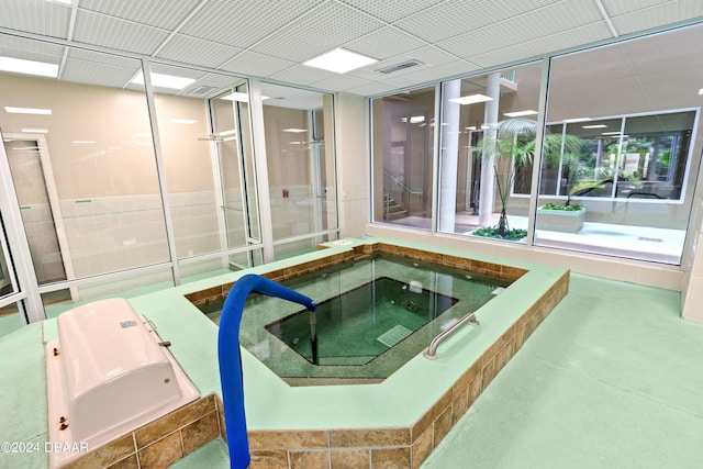 view of swimming pool featuring an indoor in ground hot tub