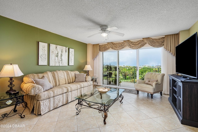 tiled living room featuring a textured ceiling and ceiling fan