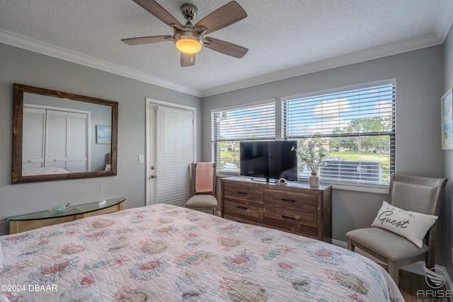 bedroom featuring a textured ceiling, ceiling fan, and crown molding