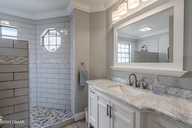 bathroom featuring hardwood / wood-style floors, plenty of natural light, and ornamental molding