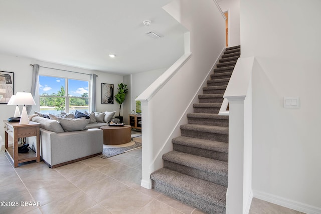 staircase with tile patterned floors