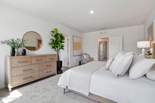 bedroom featuring light colored carpet