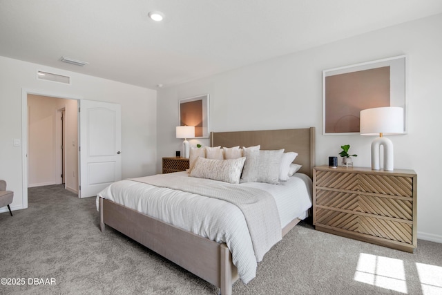 bedroom featuring light colored carpet