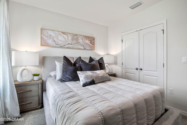 bedroom with carpet floors and a closet