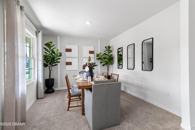 view of carpeted dining space