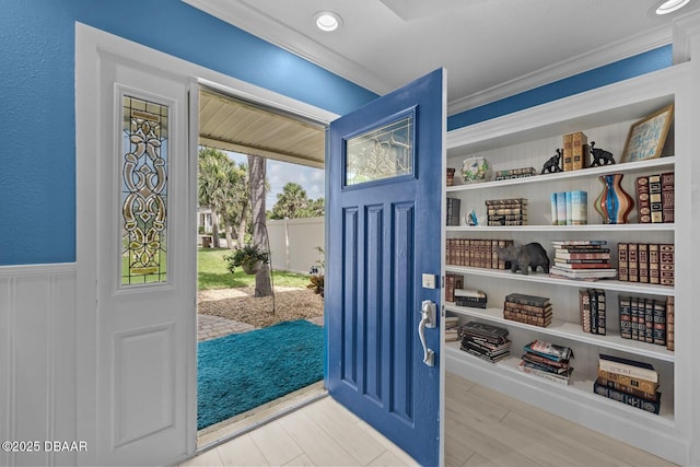 1942 N Daytona Ave, Flagler Beach, FL 32136 - entrance foyer featuring ornamental molding and a wainscoted wall