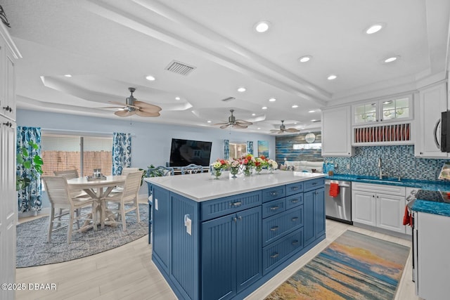 1942 N Daytona Ave, Flagler Beach, FL 32136 - kitchen featuring appliances with stainless steel finishes, white cabinetry, a raised ceiling, and recessed lighting