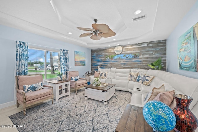 1942 N Daytona Ave, Flagler Beach, FL 32136 - living area featuring a tray ceiling, a ceiling fan, recessed lighting, and baseboards