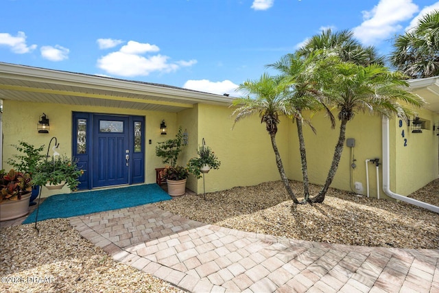 1942 N Daytona Ave, Flagler Beach, FL 32136 - property entrance featuring stucco siding and covered porch