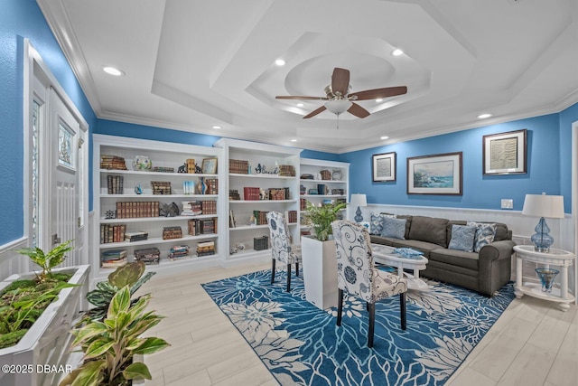 1942 N Daytona Ave, Flagler Beach, FL 32136 - living room featuring a raised ceiling, ceiling fan, recessed lighting, crown molding, and wood finished floors