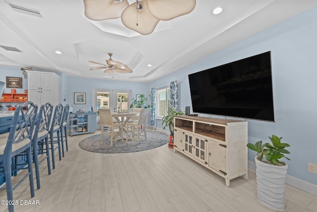 1942 N Daytona Ave, Flagler Beach, FL 32136 - dining space featuring baseboards, light wood finished floors, recessed lighting, ceiling fan, and a tray ceiling