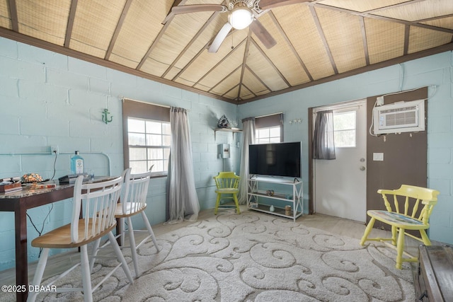 1942 N Daytona Ave, Flagler Beach, FL 32136 - living room with a wall mounted air conditioner, ceiling fan, concrete block wall, and lofted ceiling