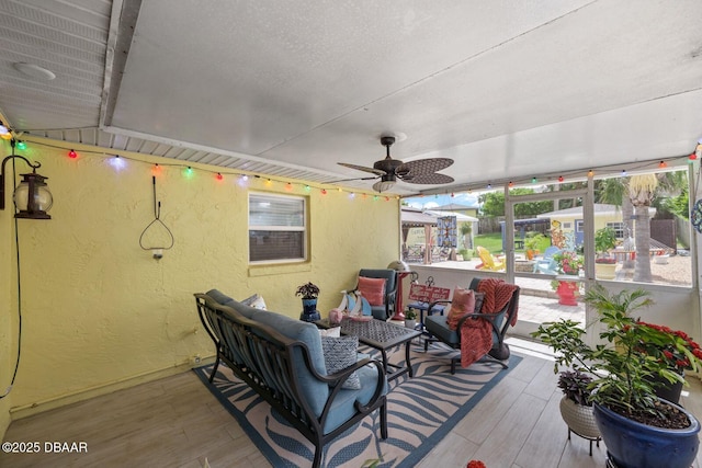 1942 N Daytona Ave, Flagler Beach, FL 32136 - wooden terrace with ceiling fan and an outdoor hangout area