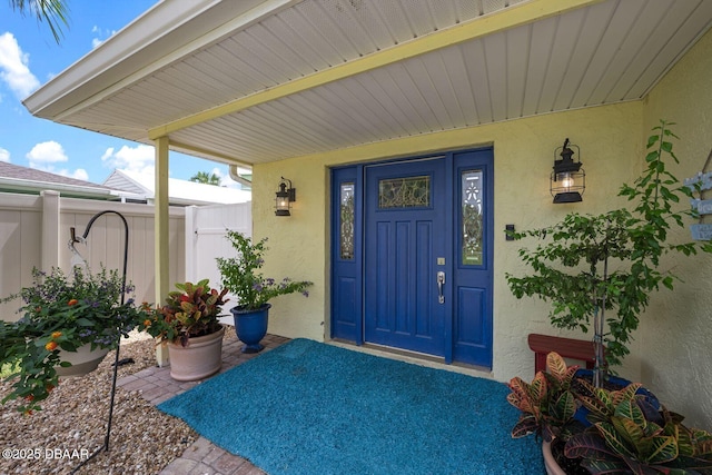1942 N Daytona Ave, Flagler Beach, FL 32136 - doorway to property featuring stucco siding