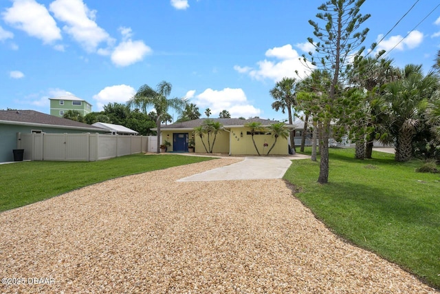 1942 N Daytona Ave, Flagler Beach, FL 32136 - view of front of property with driveway and stucco siding