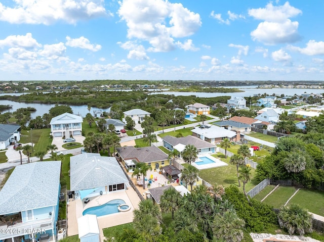 1942 N Daytona Ave, Flagler Beach, FL 32136 - aerial perspective of suburban area featuring a pool and a large body of water