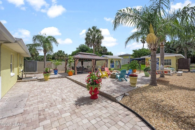 1942 N Daytona Ave, Flagler Beach, FL 32136 - view of patio / terrace featuring a gazebo and an outdoor fire pit