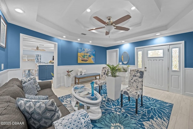 1942 N Daytona Ave, Flagler Beach, FL 32136 - living area with a ceiling fan, wainscoting, a tray ceiling, wood finished floors, and recessed lighting