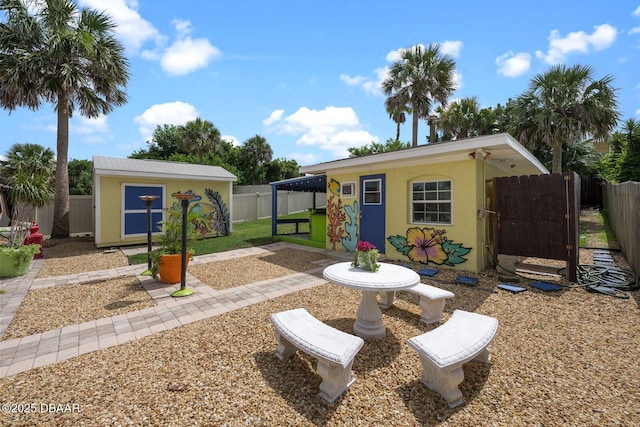 1942 N Daytona Ave, Flagler Beach, FL 32136 - fenced backyard featuring an outbuilding