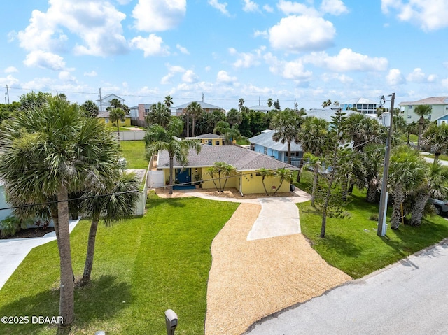 1942 N Daytona Ave, Flagler Beach, FL 32136 - view of front of house featuring driveway and a residential view