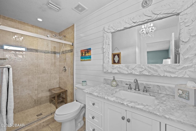 1942 N Daytona Ave, Flagler Beach, FL 32136 - bathroom with a chandelier, vanity, a stall shower, toilet, and wooden walls