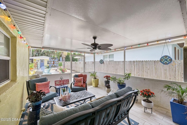 1942 N Daytona Ave, Flagler Beach, FL 32136 - sunroom with outdoor lounge area, a ceiling fan, wood finished floors, and a textured ceiling