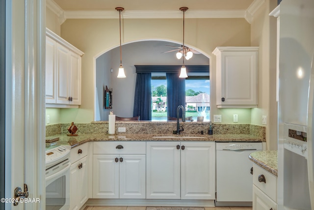 kitchen with white appliances and white cabinetry