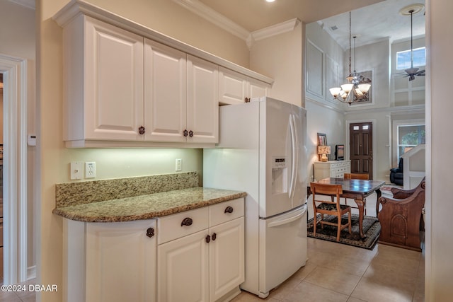 kitchen with white fridge with ice dispenser, hanging light fixtures, crown molding, a chandelier, and white cabinets