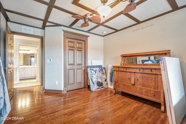 bedroom featuring hardwood / wood-style floors and coffered ceiling