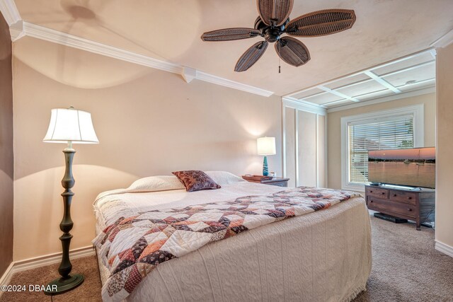 bedroom with carpet flooring, ceiling fan, and crown molding