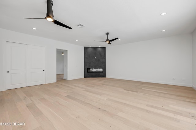 unfurnished living room featuring recessed lighting, a ceiling fan, visible vents, and light wood-style flooring
