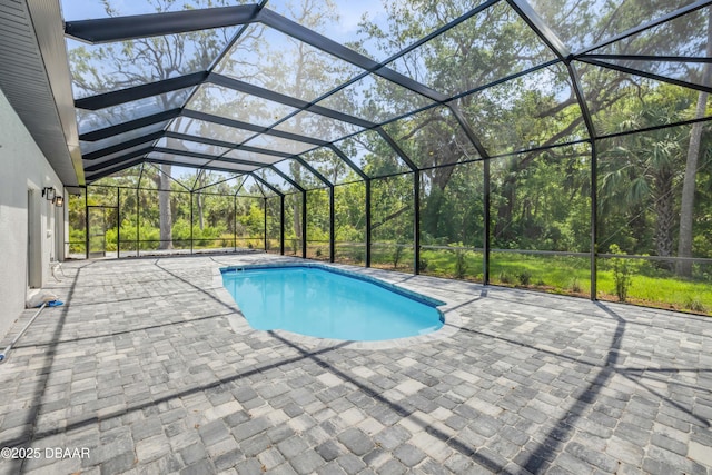 outdoor pool featuring a patio area and a lanai