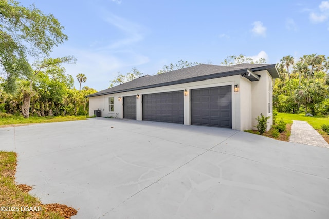 garage featuring driveway