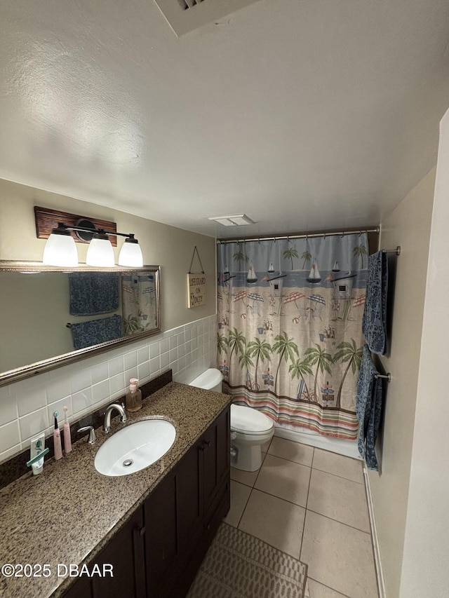 65 Seton Trl Unit 8, Ormond Beach, FL 32176 - bathroom with vanity, tile patterned floors, tasteful backsplash, and tile walls