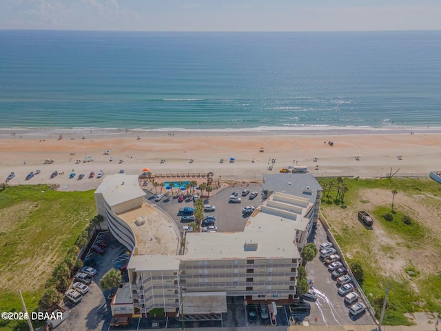 bird's eye view featuring a beach view and a water view