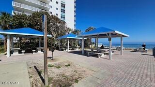 surrounding community featuring a gazebo and a water view