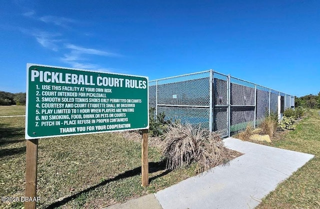 surrounding community featuring tennis court