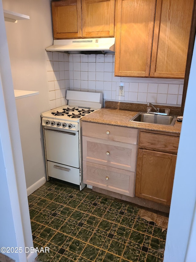 kitchen with sink, gas range gas stove, and backsplash