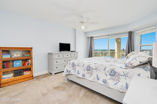 bedroom with light carpet, ceiling fan, baseboards, and access to exterior